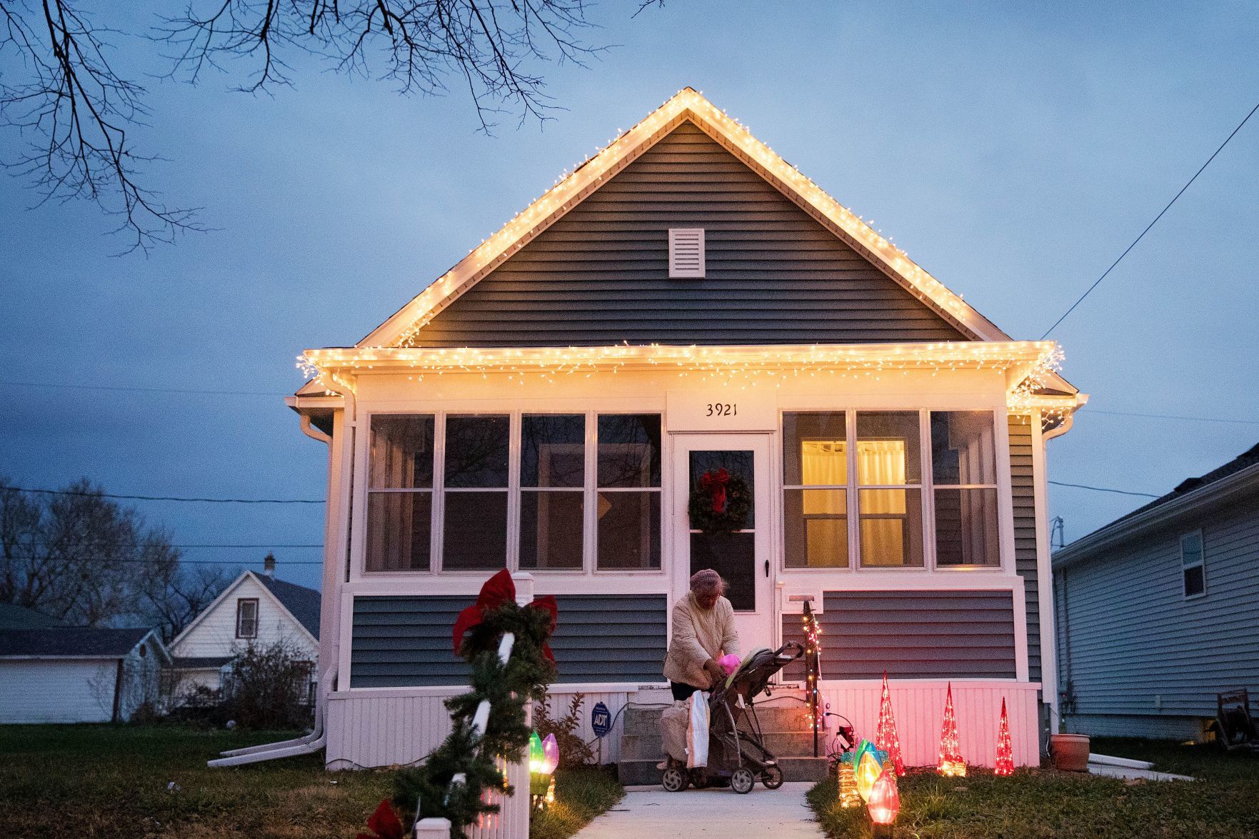 Edwina Sheppard and granddaughter Ayrian Calloway, 3, outside a decorated house in the Kountze Park area.